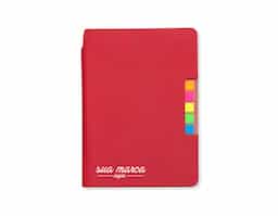 Caderno produzido em couro sintético com autoadesivos. Capa interna com cinco bloquinhos autoadesivos coloridos com aproximadamente 25 folhas cada e bloco com aproximadamente 80 folhas pardas pautadas.