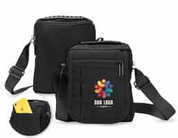 Bolsa de ombro confeccionada em nylon impermeável com alça ajustável para ombros e outra para mão. incluindo um bolso antifurto, um localizado na aba frontal, ambos com fechamento em zíper, e outro na parte interna da aba.