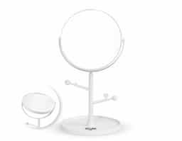 Espelho de mesa dupla face sem aumento. Possui estrutura em plástico com ganchos laterais e base circular para guardar pequenos objetos.