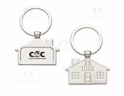 Chaveiro metal fosco formato casa. Parte frontal com desenho em relevo das janelas e portas, verso com um retângulo no centro ideal para personalização.