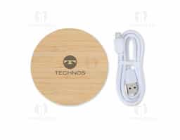 Carregador via indução formato disco com indicador de funcionamento em led, feito em Bambu. Compatível com smartphones com tecnologia por indução. Acompanha cabo USB. OBS.: O CARREGADOR APENAS TRANSFERE CARGA, ELE NÃO POSSUI BATERIA PARA ARMAZENAMENTO (NÃO É UM POWER BANK).